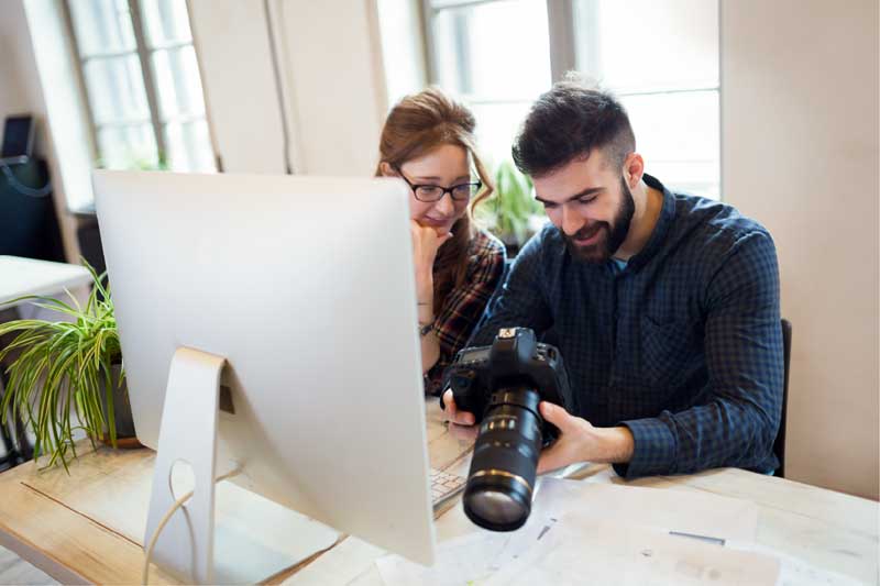 photographer looking at camera